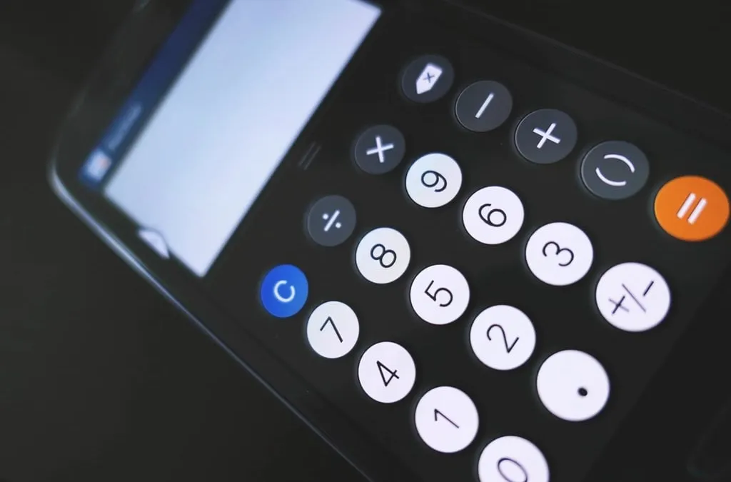A smartphone calculator with white number keys and an orange equals key on a dark background